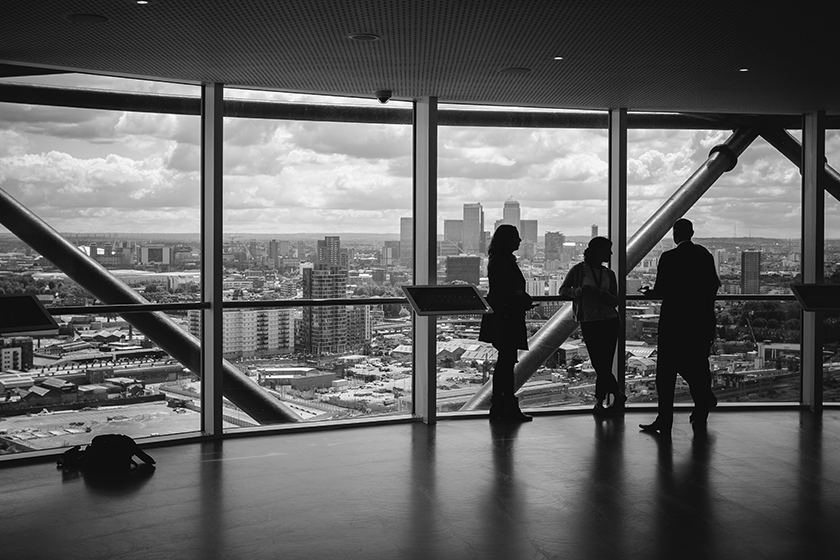 Business people overlooking city