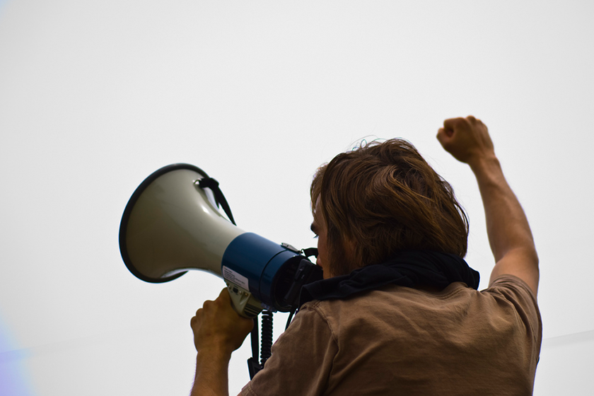 Man Yelling in Microphone