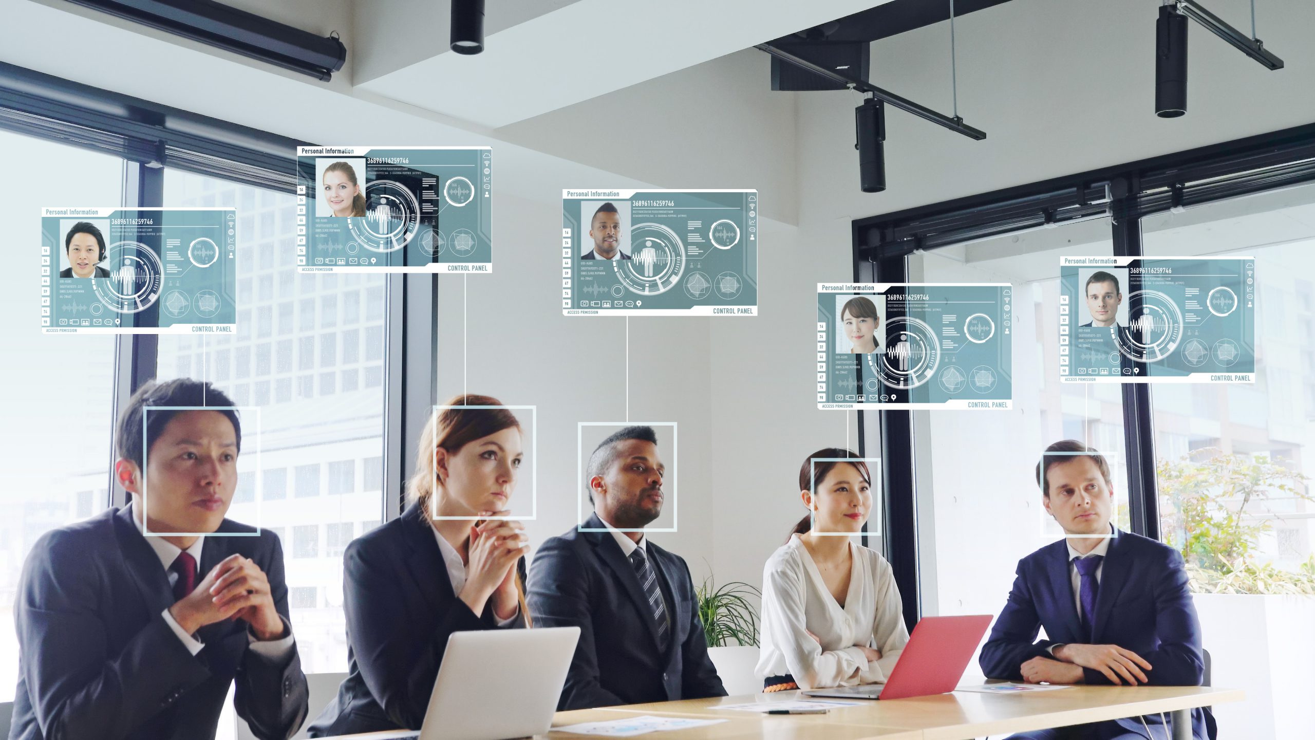 Photo of people in a board room with biometric face scans