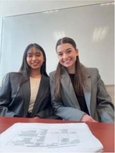 Temple Law students Victoria and Sarah Ismael preparing for Quarterfinals with their competition day materials.